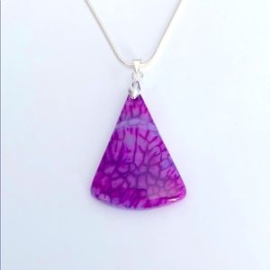 A purple& white pendant necklace